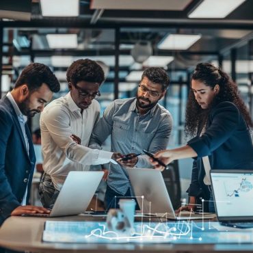 IT professionals collaborating in a modern office, emphasizing managed IT services and teamwork