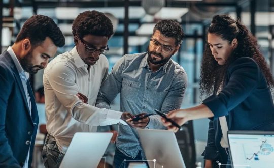 IT professionals collaborating in a modern office, emphasizing managed IT services and teamwork